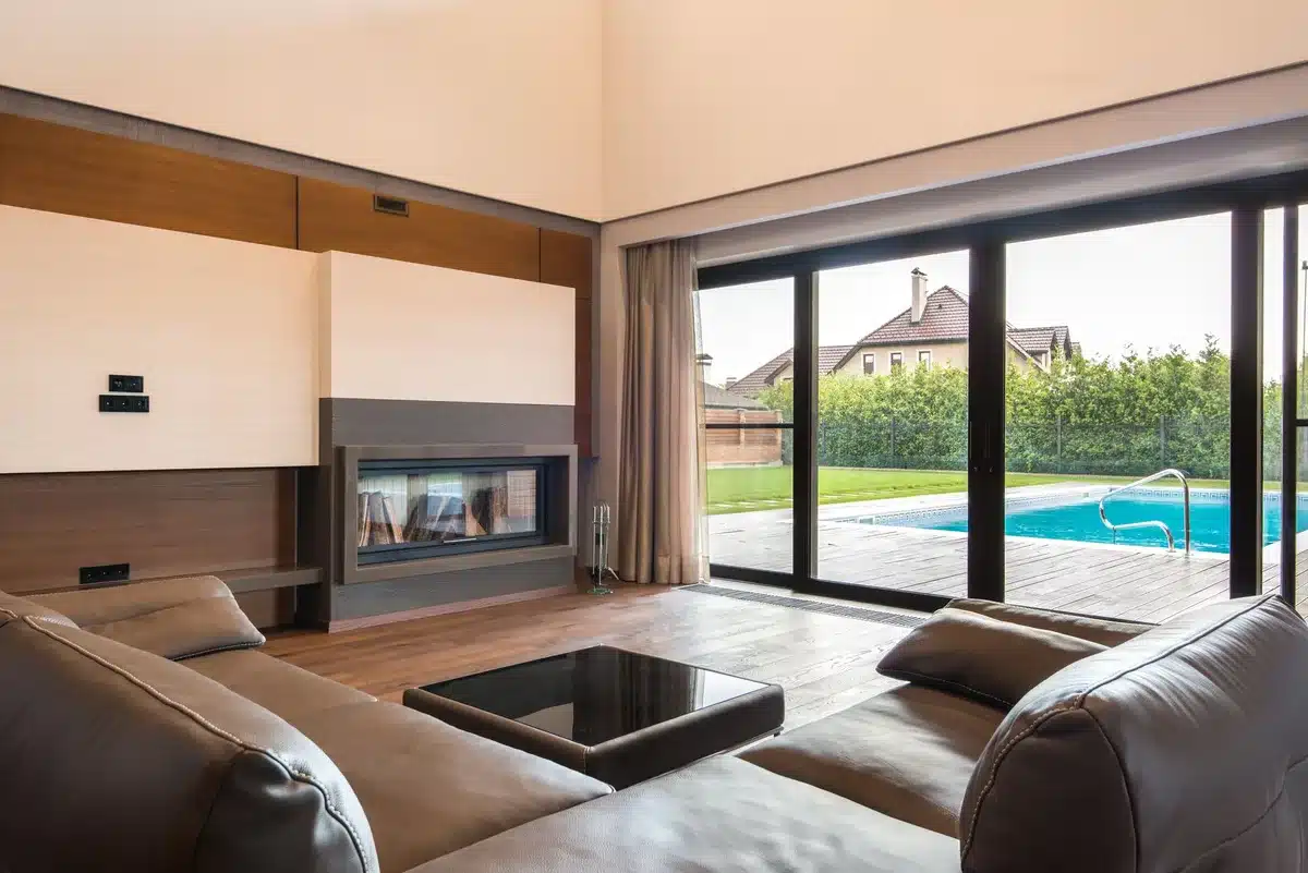 Matte glass sliding doors with vertical mullions creating visual rhythm in a contemporary hallway