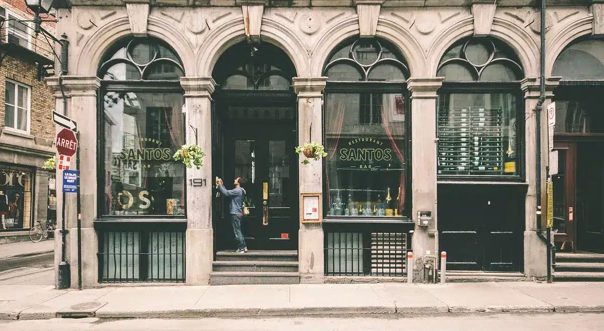 Typical Montreal triplex building with three stacked residential units behind a single front facade