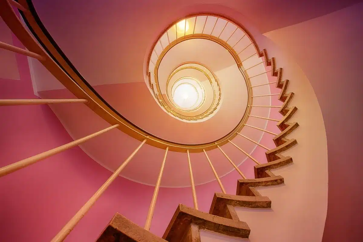 Contemporary interior with staircase, internal windows, and continuous sightlines linking spaces